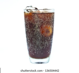 Ice Cube Splashing Into Glass Of Coke White Background.