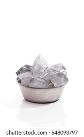 Ice Cube In A Steel Bowl Over White Background