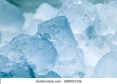 Ice cubes as background texture closeup photo