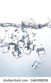 Ice cubes falling into the clear water Create beautiful bubbles
