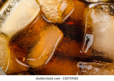 Ice Cubes Floating In A Glass Of Coke