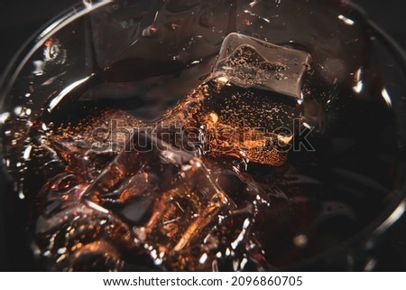 Ice cubes in a glass of soda