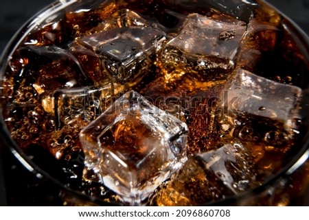 Ice cubes in a glass of soda