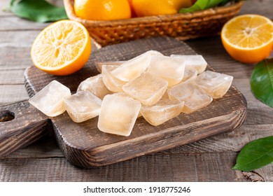 Ice cubes with lemon in tray on a table, closeup - Shutterstock ID 1918775246