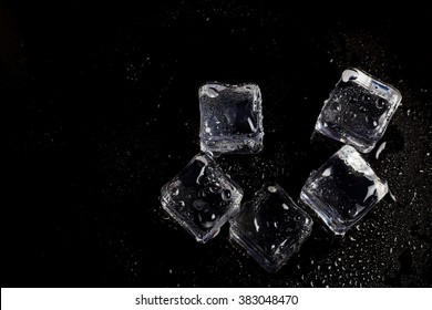 Ice Cubes On Black Background.