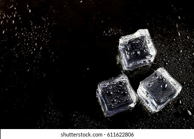 Ice Cubes On Black Background.