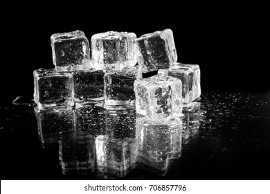 Ice Cubes On Black Background.