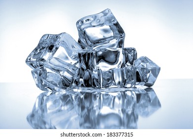 Ice cubes on blue background - Shutterstock ID 183377315