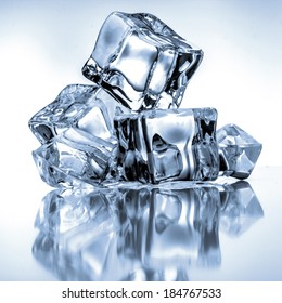 Ice cubes on blue background - Shutterstock ID 184767533