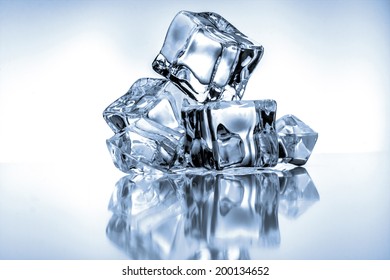 Ice cubes on blue background - Shutterstock ID 200134652