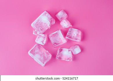 Ice cubes on pink background 