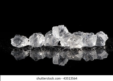 Ice Cubes On A Wet Black Background