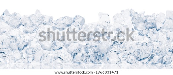 Ice cubes on white background. Heap
of crushed ice cubes in white background wide
shot.