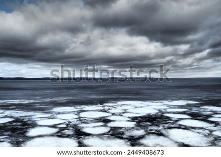Ice drift in spring on Lake Onega, Karelia. Dangerous thin spring ice in April. Aggregate accumulations of fine-crystalline grains. Opening of small lakes, ponds and reservoirs. Crushed ice floes