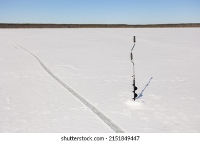 The Ice Drill On The Frozen Lake.