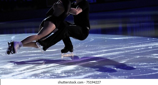 Ice Figure Skating Pair With Shadows On Ice