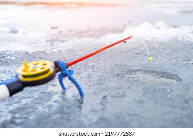 Ice Fishing Rod With The Lure By The Hole