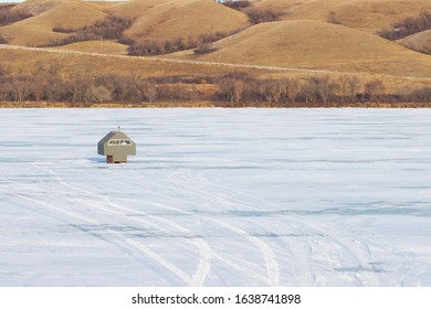 Ice Fishing Shack On Frozen Lake In Winter