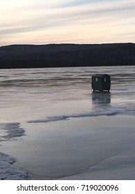 Ice Fishing Shack On Frozen Lake