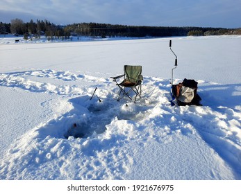 Ice Fishing. Winter Fishing, Catching A Fish In The North Of Sweden