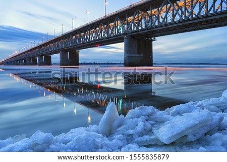 Ice floating on the Amur river. Amur bridge. Trans siberian railway. Khabarovsk, far East, Russia.