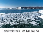  Ice floe floating on water Baikal lake.
Lake Baikal spring, the time of melting ice. Journey to Siberia for winter Baikal.