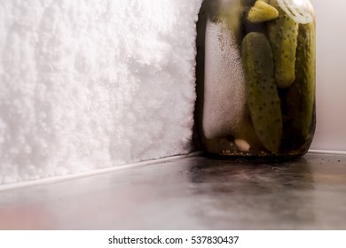 Ice formation on the inner surface of the refrigerator . the malfunction of the refrigerating chamber