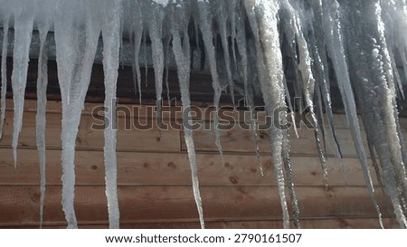 Ice Formations Caution. Sunlit Icicles On Roof Indicate Possible Slipping Hazards During Thaw . Media