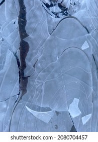 Ice fragments in top view - landscape format; Ice surface for background; Frozen water surface; Danger on thin ice