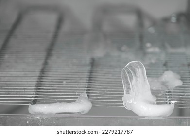 Ice full in empty freezer of a refrigerator makes refrigerator work harder and broken. Broken refridgerator. refridgerator problem