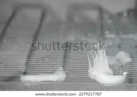 Ice full in empty freezer of a refrigerator makes refrigerator work harder and broken. Broken refridgerator. refridgerator problem