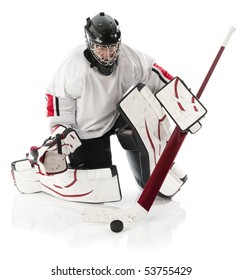 Ice Hockey Goalie Blocking A Puck With Stick. Photo On White Background