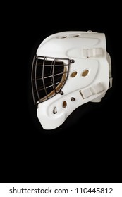 Ice hockey goalie mask. White helmet with dark wires. Isolated on black.