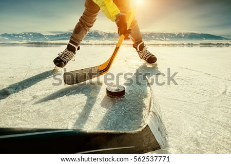 Ice hockey on the frozen lake game moment