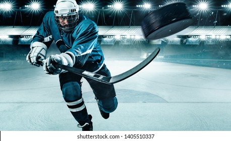 Ice Hockey Player Athlete In The Helmet And Gloves On Stadium With Stick. Action Shot. Sport Concept.