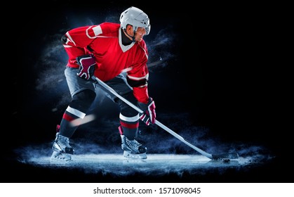 Ice Hockey Player Isolated On Black Background