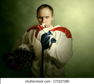 Ice Hockey Player Portrait In Dramatic Light