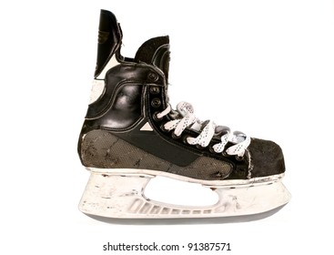 Ice hockey skate, isolated against a white background.  Close up details and texture of this scuffed up old skate.