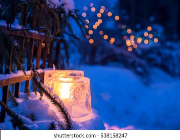 Ice Lanterns, Used As A Christmas Outdoor Decoration In Finland. Fairy Lights On The Background. Shallow Depth Of Field.