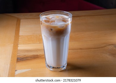 Ice Latte In A Large Glass On A Wooden Table
