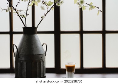 Ice Latte Next To Vase And Window