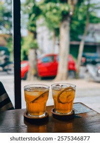 Ice lemon tea is a refreshing cold beverage made from brewed tea, typically black tea, mixed with lemon juice and sweetened with sugar or syrup. It is served over ice.