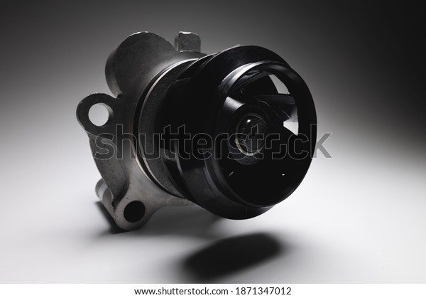 ICE liquid cooling pump. Engine coolant pump.\
Contrast light on gray\
background
