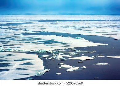 ice at North pole and near (from 88 to 90 degrees) in 2016. Rare now perennial ice broken by nuclear icebreaker. Broken ice behind (channel), expedition to North pole