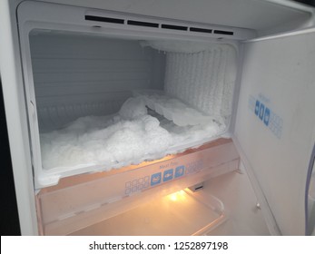 Ice on freezing compartment of refrigerator.