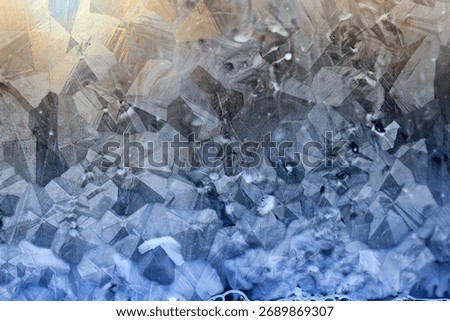 ice pattern on winter glass, abstract background on a cold sunny day
