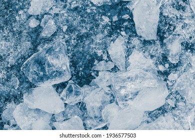 Ice Pieces Texture Background. Crushed Ice Blue Toned Pattern.