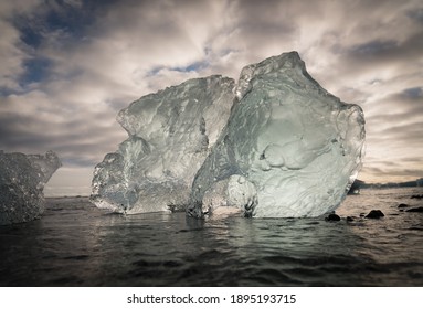 Ice is pushed back onto the black sand beach at Diamond Beach, Iceland. - Powered by Shutterstock