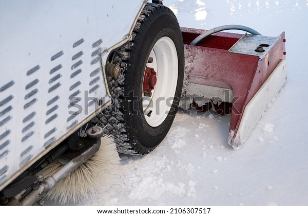 Ice recondition machine\
car closeup, ice rink ice maintenance polishing and leveling for\
sport outdoors. 