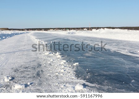 Ice road on a frozen reservoir in the winter,  Ob River, Siberia, Russia
